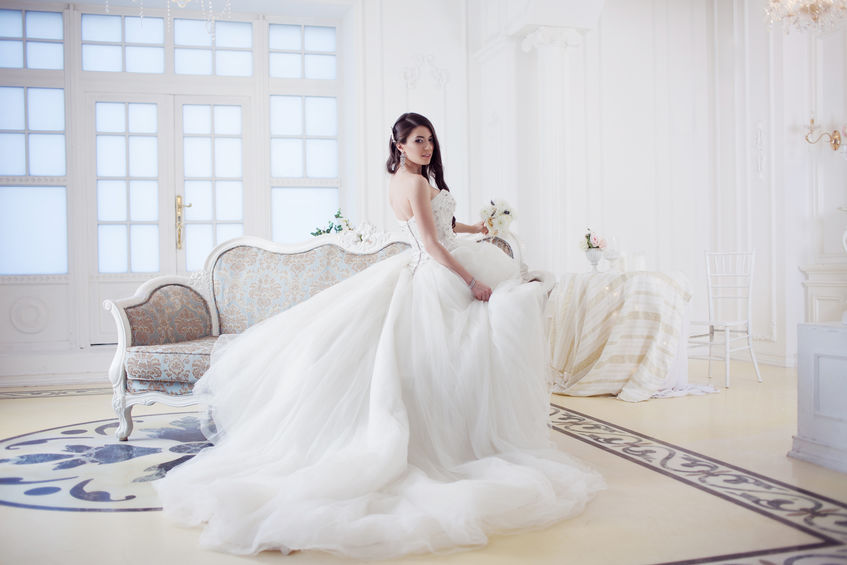 Portrait Of Beautiful Bride. Wedding Dress With Open Back. Luxurious Light Interior